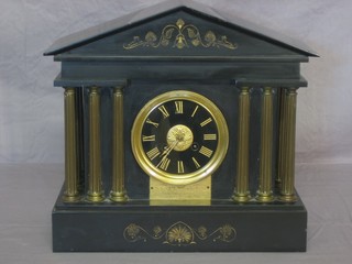 A Victorian French 8 day striking mantel clock contained in a black marble architectural case
