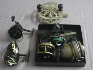 A centre pin fishing reel and 4 multiplying reels