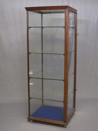 An Edwardian rectangular mahogany pedestal shop display cabinet 66"