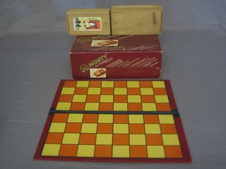 2 wooden chess sets, a chess board and a portable computer game console