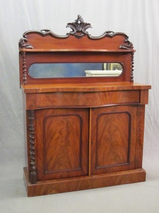 A Victorian mahogany chiffonier with raised mirrored back, the base of serpentine outline with drawer flanked by pair of spiral turned columns, raised on a platform base 42"