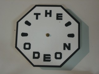 An octagonal plastic Odeon wall clock, the reverse marked Commemorating The 50th Year of The Odeon Muswell Hill 1936-1986 9"