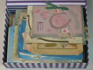A box containing a collection of various birthday cards