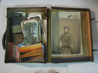 An attache case containing a collection of postcards