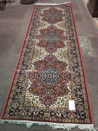 A rust ground Persian style cotton runner 108" x 30"