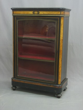A Victorian ebonised and walnut D shaped Pier cabinet, fitted shelves enclosed by glazed panelled doors with gilt metal mounts 27"