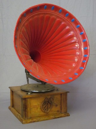 A wooden cased gramophone with red pressed metal horn, the wooden case with Royal Flying Corps crest ILLUSTRATED