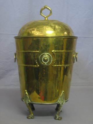 A cylindrical copper twin handled coal box