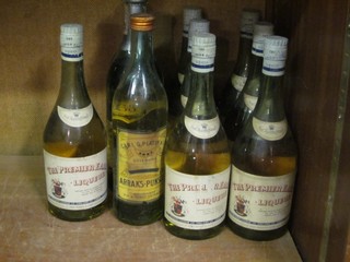 7 bottles of The Premier Liqueur, 2 bottles of Pernod and 1 other bottle
