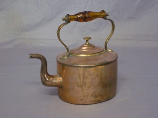 A 19th Century oval copper kettle with amber glass handle