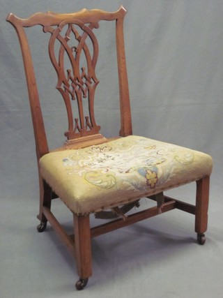 An 18th Century elm Chippendale style nursing chair with pierced vase shaped slat back and Berlin wool work seat