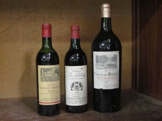 A large bottle of 1967 Chateau Route Cote de Fronsac, a bottle of 1969 Chateau Cos Labory Medoc and a bottle of 1971 Chateau Magence-Meragnac