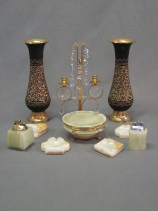 A pair of Eastern gilt metal vases, a gilt metal twin light lustre 10" and a collection of onyx ashtrays, jars etc