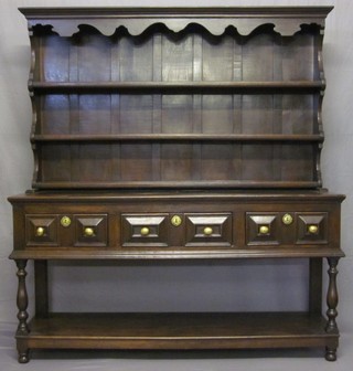 An 18th Century oak dresser, the raised back fitted 2 shelves, the base fitted 3 long drawers above a cupboard, raised on turned supports 65" ILLUSTRATED