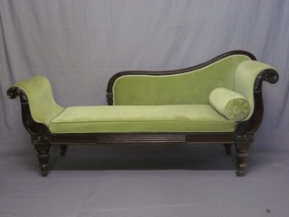 A William IV mahogany show frame sofa upholstered in green material and raised on fluted supports 79"