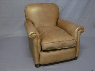 A mahogany framed armchair upholstered in light brown leather