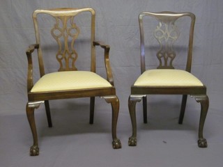 A walnut Chippendale style carver chair with vase shaped back and upholstered seat, raised on cabriole supports, together with  a standard chair