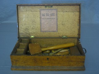 A collection of 19th Century handyman tools contained in an oak tool chest with hinged lid