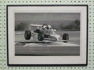 A  black and white photograph of a Camel motor racing car no.2, dedicated to Q, indistinctly signed, 9" x 13"