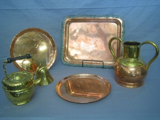 A copper and brass twin handled urn 9 1/2", a brass spirit kettle, a brass bell and 3 copper trays