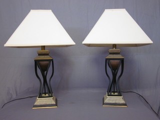 A handsome pair of iron  and wooden table lamps 19"