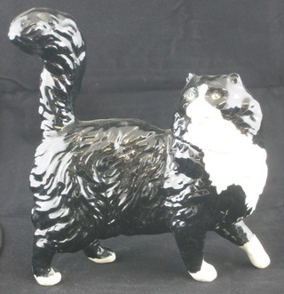 A Royal Doulton figure of a walking black and white cat 5"