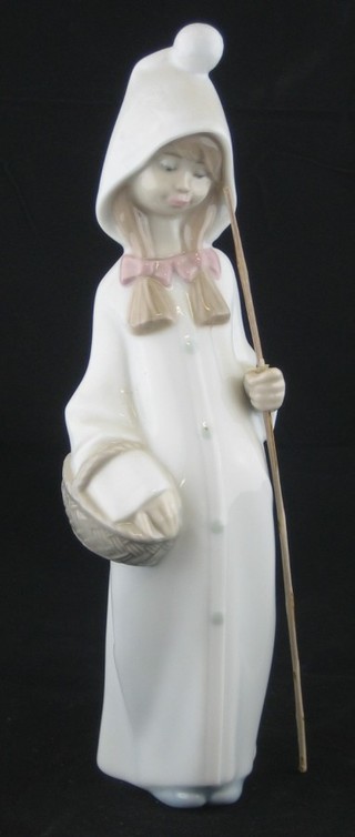 A Lladro figure of a girl with stick and basket 8"