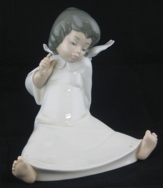 A Lladro figure of a reclining Angel 6"