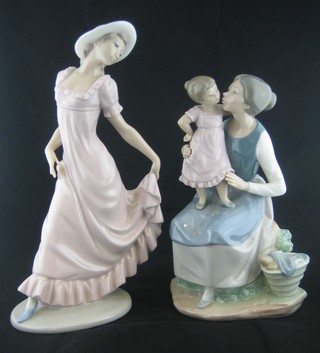 A Nao figure of a standing bonnetted walking lady 11" together with a Nao figure of a seated mother and child 9"