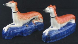 A pair of Staffordshire style pen rests in the form of seated grey hounds 7" ILLUSTRATED
