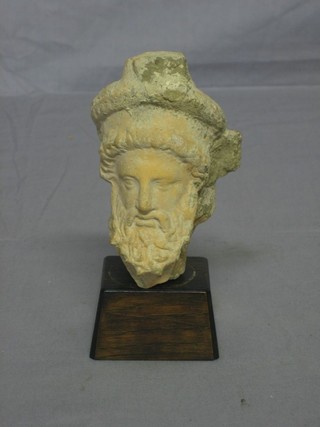 A Greek terracotta portrait bust of Dionysus  ILLUSTRATED