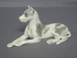 A Soviet Russian porcelain figure of a reclining dog 9"