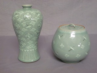 An Oriental Celadon glazed porcelain vase 9" and a circular jar and cover 6"