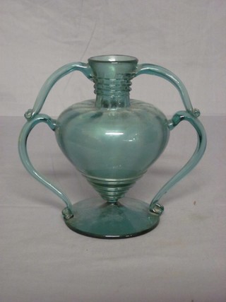 A hand blown turquoise coloured glass twin handled vase 8"