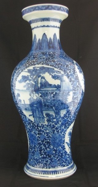 An Oriental blue and white club shaped vase decorated figures 17"