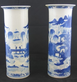 A pair of Oriental blue and white cylindrical vases decorated landscape, the base with 4 character mark 10" (1 restored to rim)