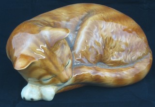 A Goebel figure of a ginger curled sleeping cat 8" (chip to ear)