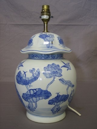 An Oriental style blue and white porcelain table lamp in the form of an urn 12"
