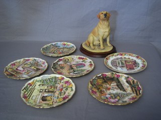 A Border Fine Art figure of a seated yellow Labrador 9" together with 6 Royal Albert Christmas plates