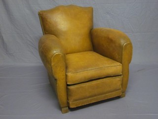 A mahogany framed armchair upholstered in brown leather