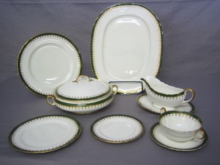 A 61 piece Aynsley dinner service with green and gilt banding comprising 2 oval meat plates 15" and 13", 2 circular twin handled tureens and covers 8 1/2", sauce boat and stand, 10 twin handled soup bowls and saucers (1 cracked), 12 tea plates 6 1/2", 12 