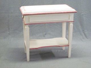 A white and red painted French rectangular 2 tier occasional table, fitted 2 drawers and raised on turned and fluted supports 26"