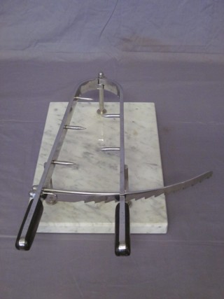 A large chrome and marble meat clamp, marked Lauffer Incx