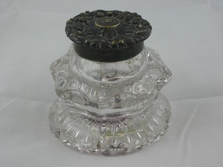 A Victorian circular glass inkwell with gilt metal hinged lid 3 1/2"