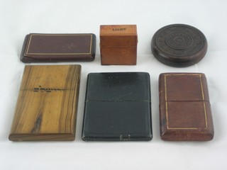 An olive wood card case, 3 leather card cases, a leather cased match box and a circular carved wooden paperweight 2"