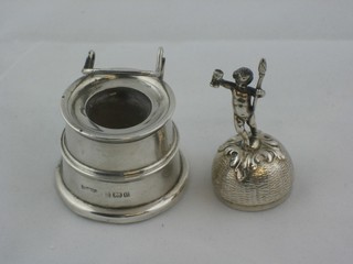 An Edwardian silver ink well, Birmingham 1904 together with a silver lid the finial in the form of a standing boy