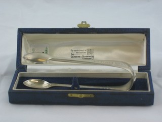 A pair of silver sugar tongs by Garrards, to commemorate the Coronation of George VI, engraved and presented by Lord and Lady Deresbury, Sheffield 1936