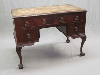 A Chippendale style mahogany writing table with inset writing surface above 2 long and 2 short drawers, raised on cabriole ball  and claw supports 42"