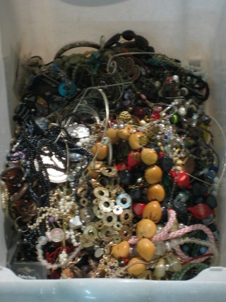 A grey plastic box containing collection of costume jewellery