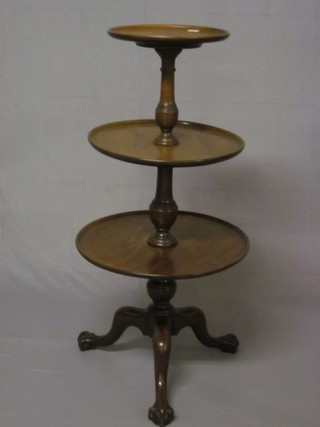 A 19th Century mahogany circular 3 tier dumb waiter, raised on pillar and tripod supports with ball and claw feet 22"  ILLUSTRATED